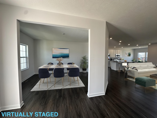dining area with dark wood finished floors, baseboards, recessed lighting, and a textured ceiling