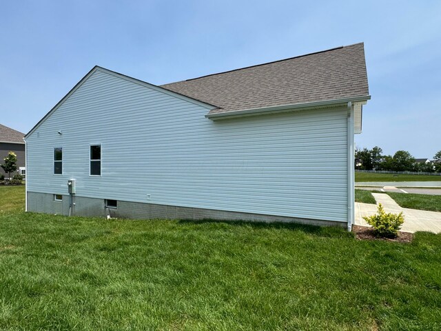 450 Creekside Dr, Commercial Point, OH 43116 - view of home's exterior with a yard and a shingled roof