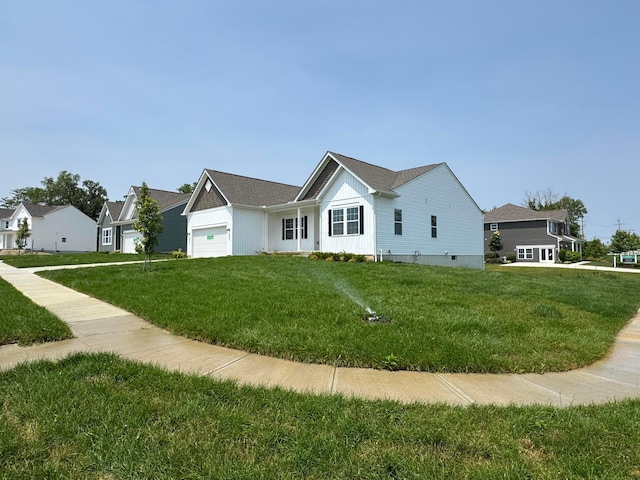 450 Creekside Dr, Commercial Point, OH 43116 - view of front of house featuring an attached garage and a front lawn