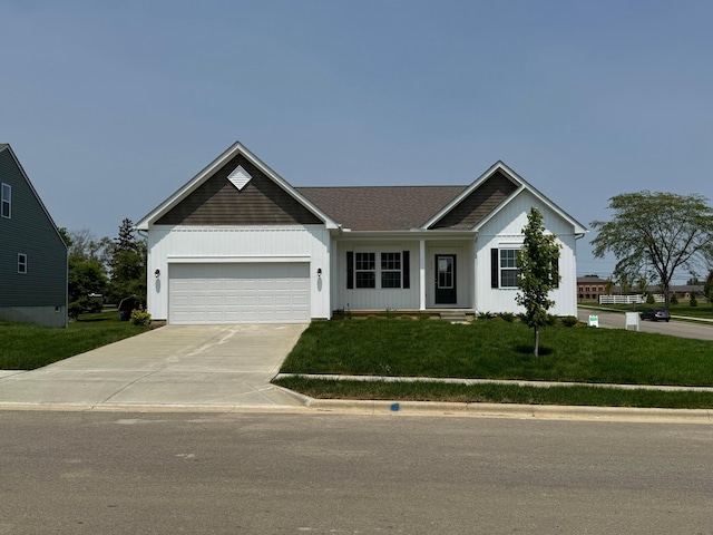 450 Creekside Dr, Commercial Point, OH 43116 - single story home with driveway, a garage, and a front yard