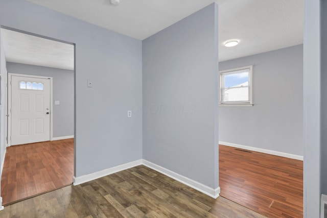 entrance foyer featuring dark hardwood / wood-style floors