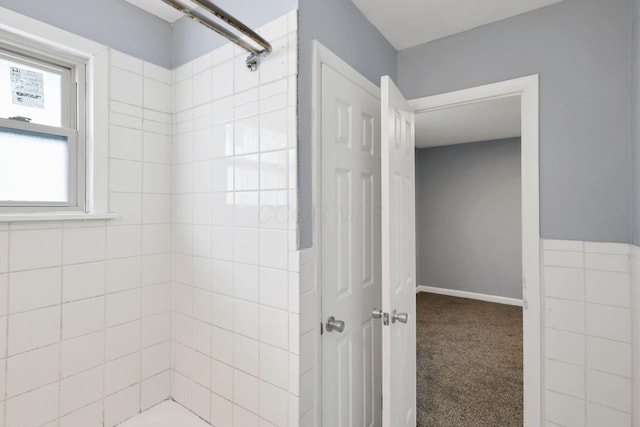 bathroom with tiled shower