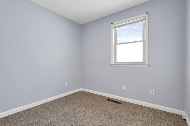 spare room with carpet flooring