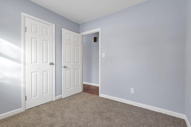 unfurnished bedroom with carpet floors