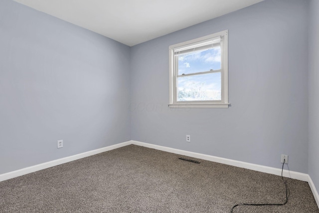 spare room featuring carpet