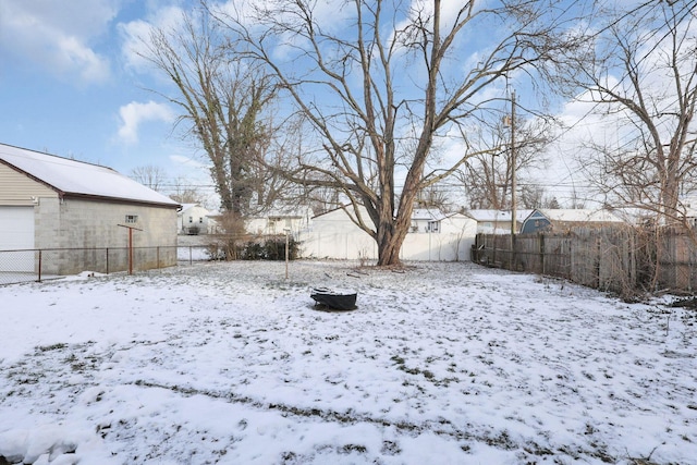 view of yard layered in snow