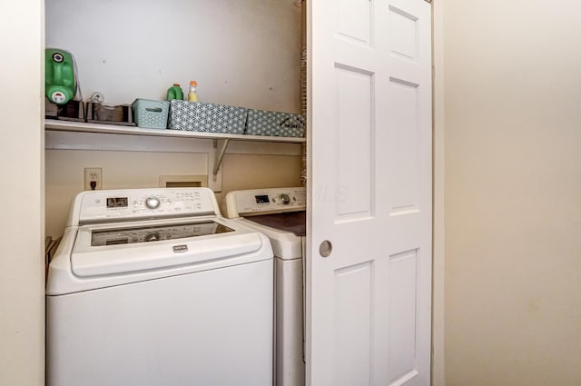 laundry room featuring washing machine and dryer