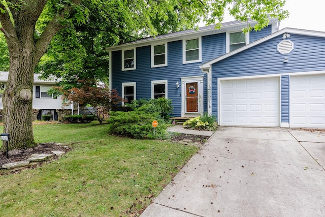 view of front of home with a garage and a front yard