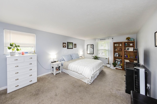 carpeted bedroom with a textured ceiling