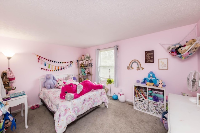 carpeted bedroom featuring a textured ceiling