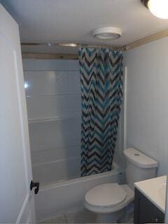 full bathroom with vanity, toilet, and shower / bathtub combination with curtain