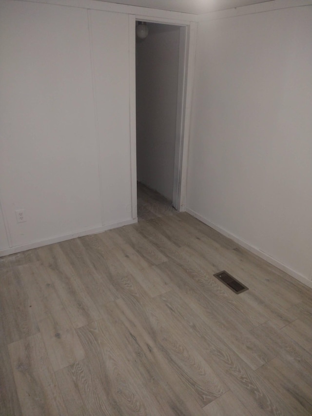 unfurnished room featuring light hardwood / wood-style flooring