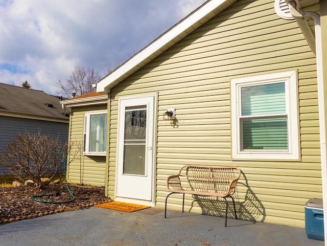 property entrance featuring a patio area