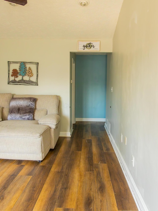 interior space featuring dark wood finished floors and baseboards