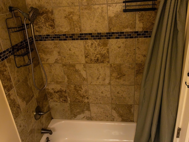 bathroom featuring shower / bath combo with shower curtain