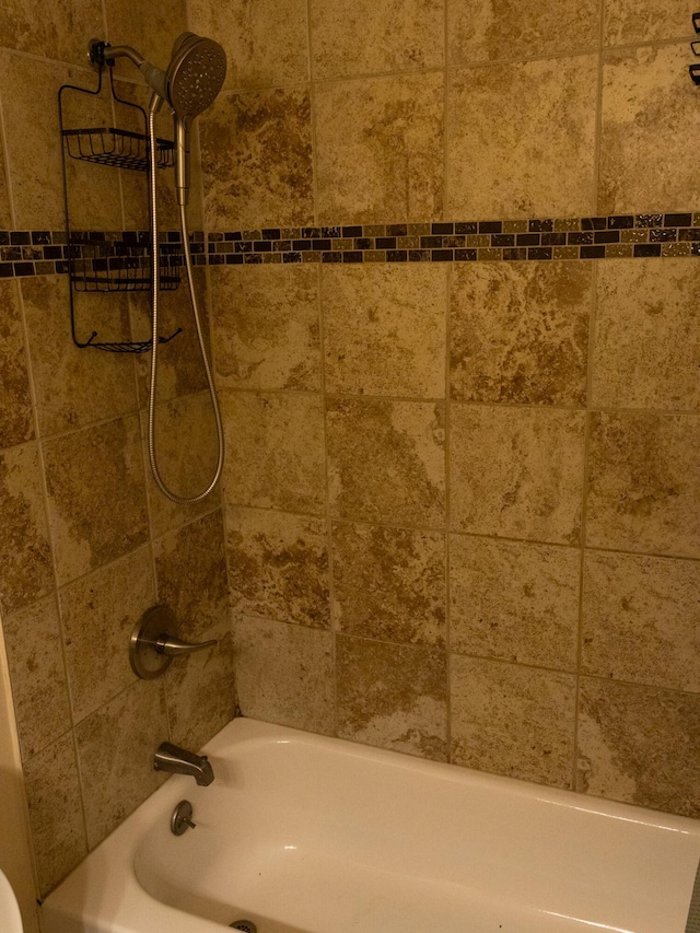 room details featuring shower / bath combination