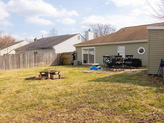 view of yard featuring a patio, cooling unit, and fence