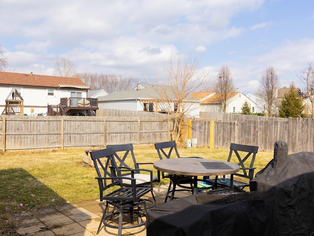 view of patio with a residential view, outdoor dining area, and a fenced backyard