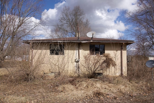 view of home's exterior featuring crawl space and stucco siding