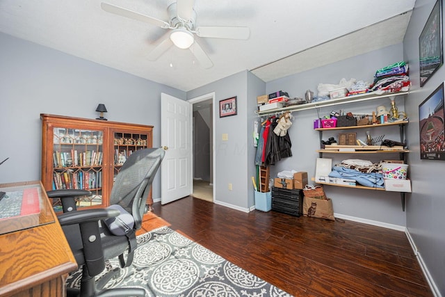 office with dark wood-type flooring and ceiling fan