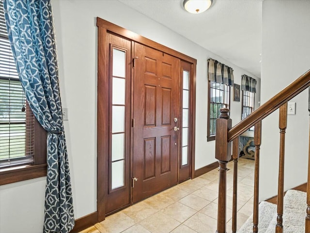 foyer with light tile patterned floors