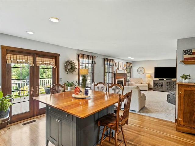 dining area featuring light hardwood / wood-style flooring and french doors