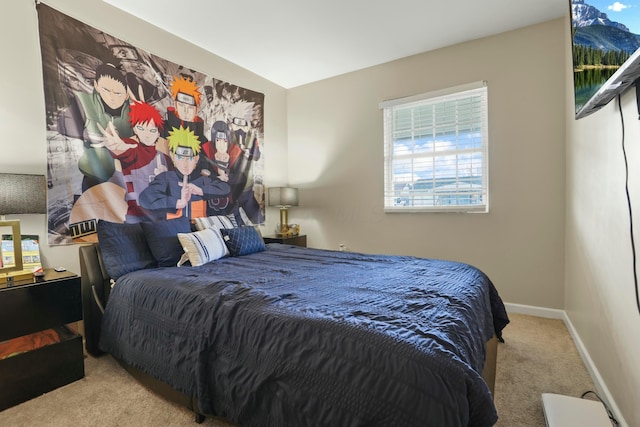 bedroom with light colored carpet