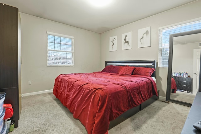 bedroom with light carpet