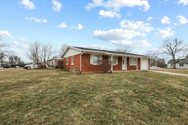 single story home featuring a garage and a front lawn