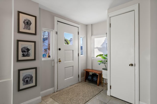 entrance foyer with light tile patterned flooring