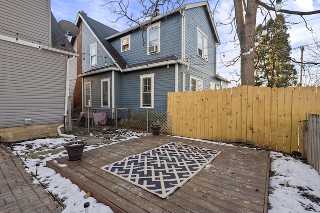 snow covered deck featuring cooling unit