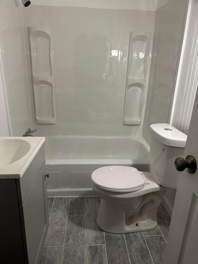 full bathroom with shower / tub combination, vanity, and toilet