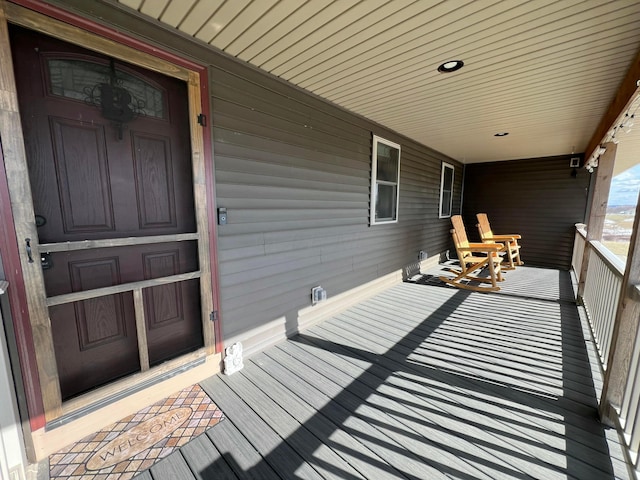 wooden deck featuring covered porch