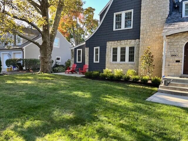 exterior space featuring a yard and a patio area