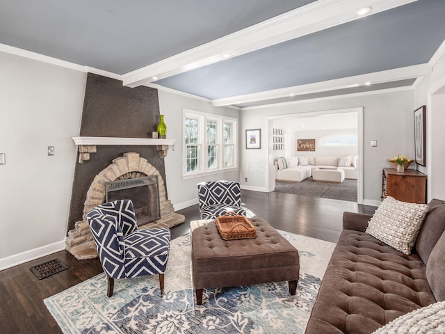 living room featuring ornamental molding, a fireplace, and dark hardwood / wood-style flooring