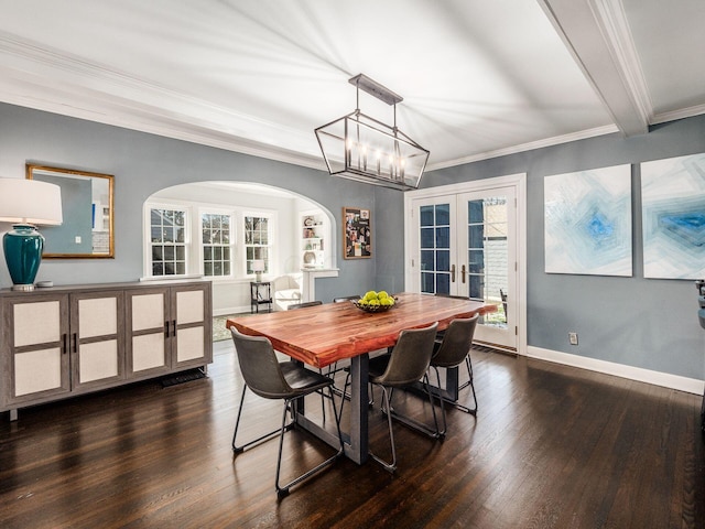 dining space featuring french doors, crown molding, dark wood-type flooring, and beam ceiling