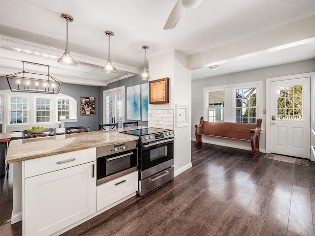 kitchen featuring pendant lighting, white cabinetry, dark hardwood / wood-style floors, light stone counters, and stainless steel electric range oven