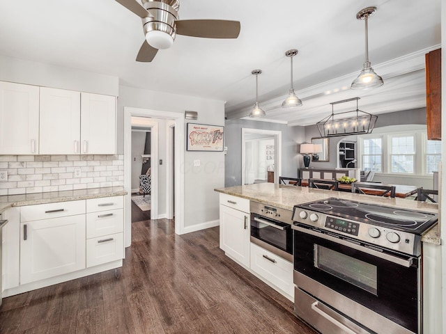 kitchen with decorative light fixtures, white cabinetry, backsplash, dark wood-type flooring, and electric stove