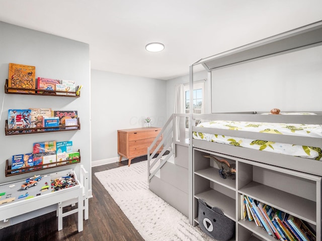 bedroom with dark wood-type flooring