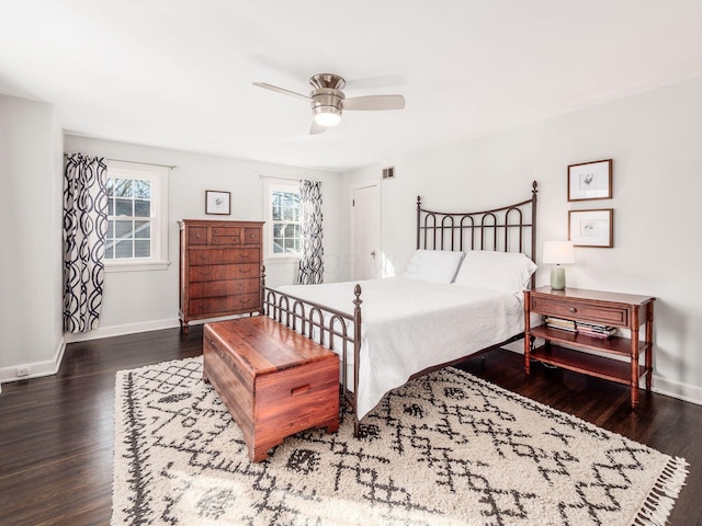 bedroom featuring dark hardwood / wood-style flooring and ceiling fan