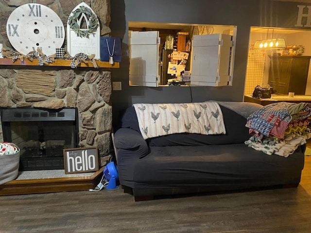 living room featuring hardwood / wood-style flooring and a fireplace