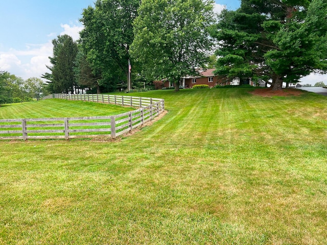 view of yard with a rural view