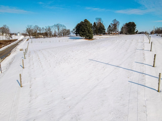 view of yard layered in snow