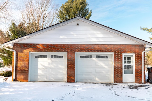 view of snow covered garage