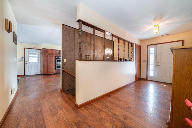 foyer featuring hardwood / wood-style flooring and a healthy amount of sunlight