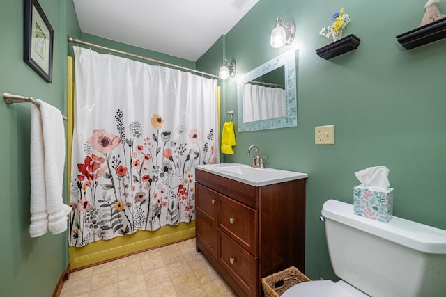 full bathroom featuring vanity, shower / tub combo, and toilet