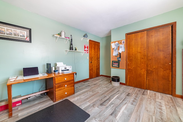 office area with light hardwood / wood-style flooring