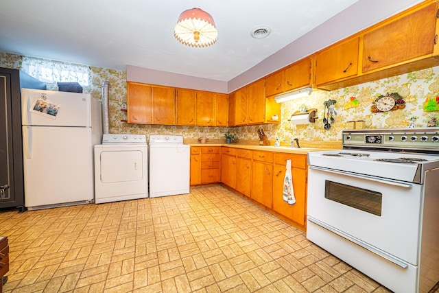 kitchen with sink and white appliances