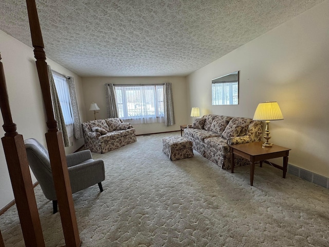 carpeted living room featuring a textured ceiling