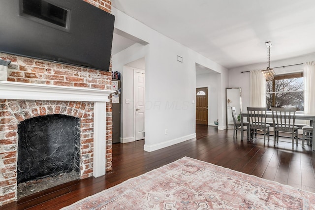 living room featuring dark hardwood / wood-style floors and a fireplace